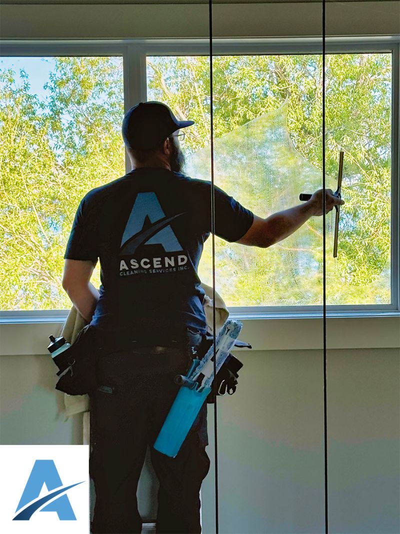 Ascend employee washing windows Ascend Cleaning Services Inc.