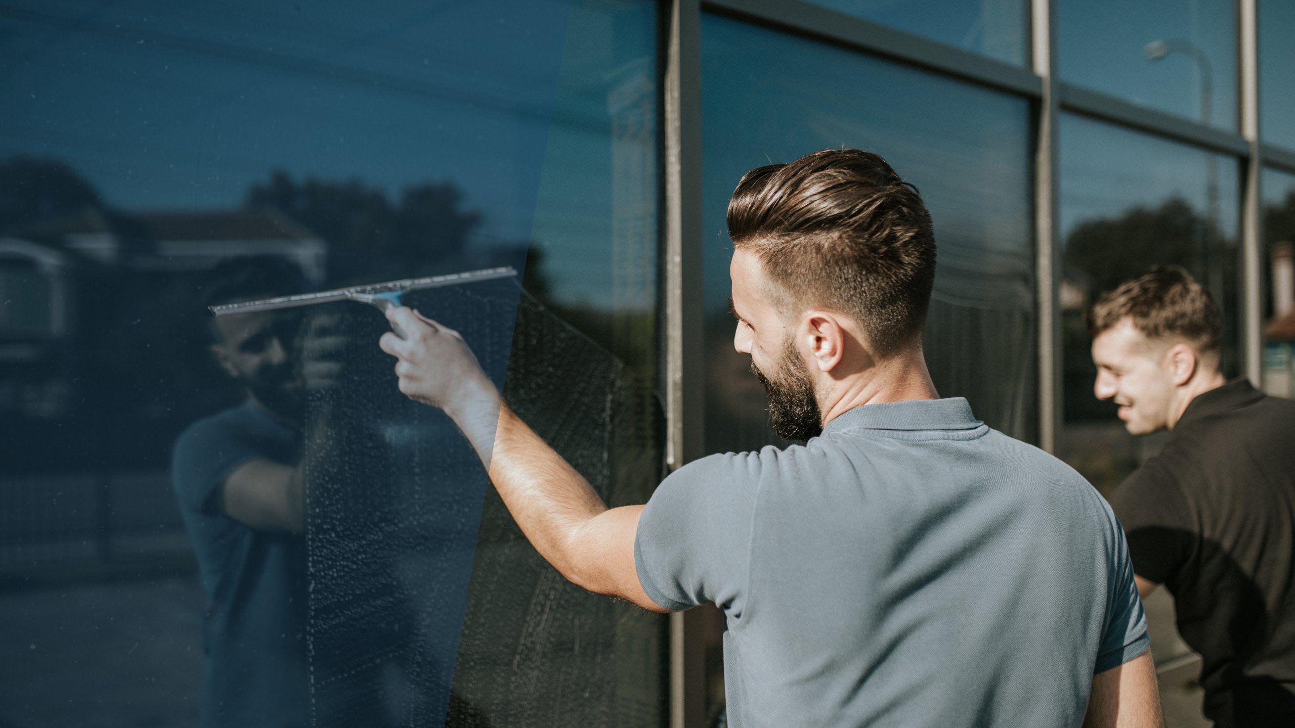 Ascend window cleaning team cleaning windows on building Ascend Cleaning Services Inc.